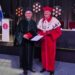 Zdjęcie w togach od lewej prof. Jan Wiktor i prof. Bernard Ziębicki z medalem w tle podium